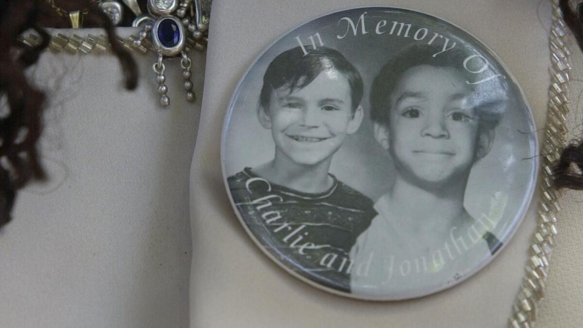 Milena Sellers wore a button with a photo of her son Jonathan and his friend Charlie Keever, who were killed by Scott Erskine.