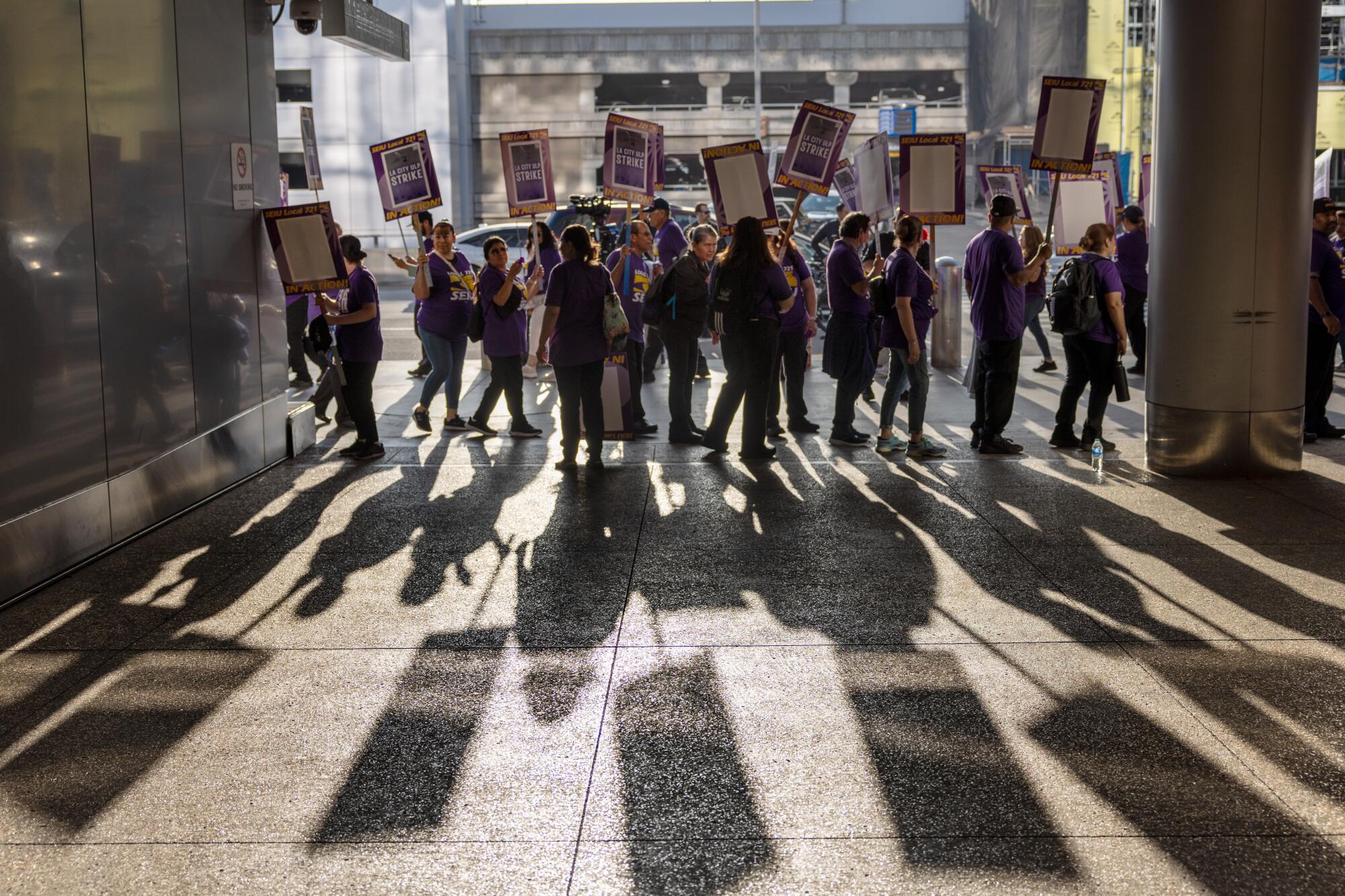 Los Angeles city workers on the picket lines Tuesday at LAX.