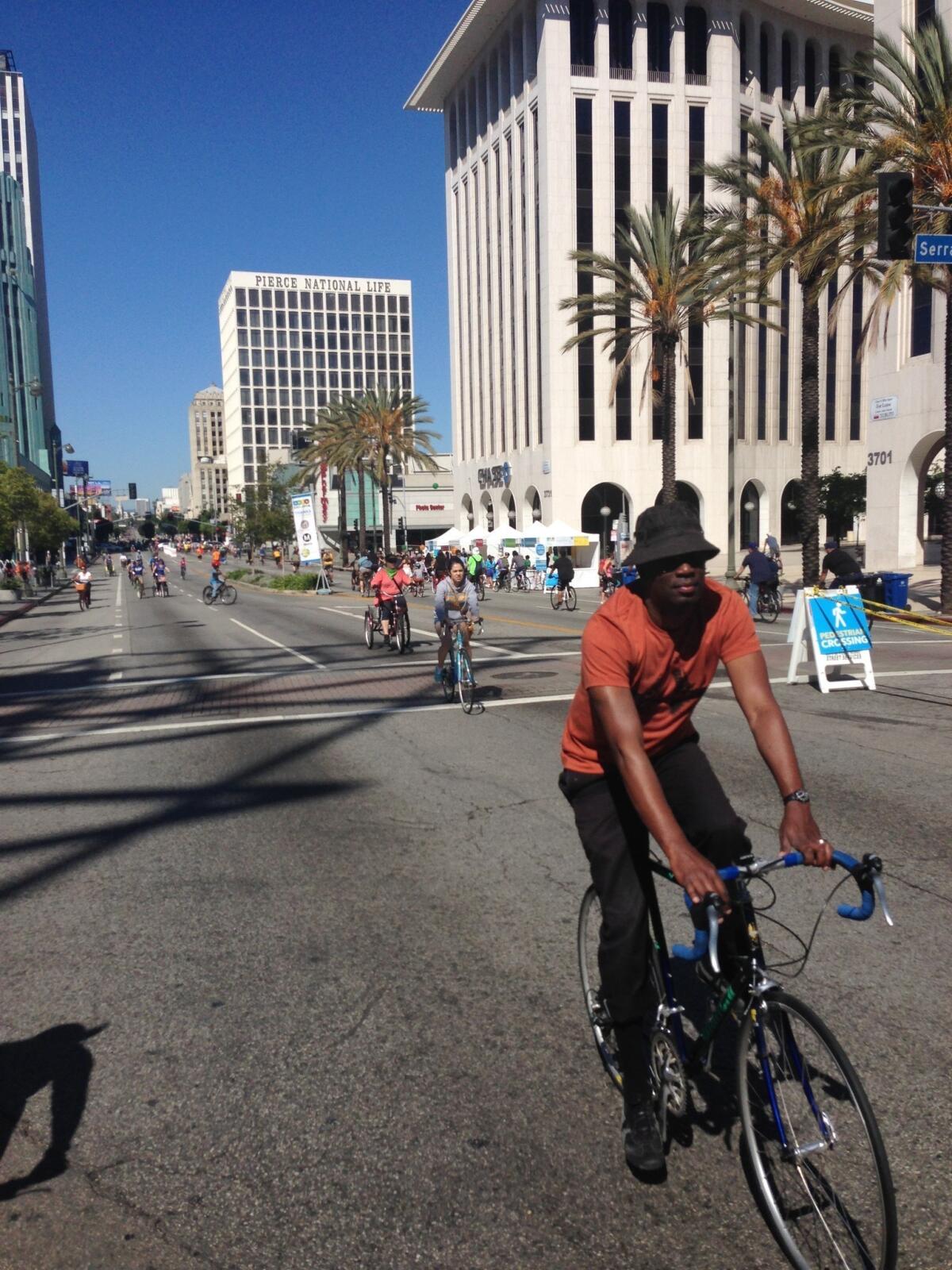 Cyclists make their way down Wilshire Boulevard in Koreatown.