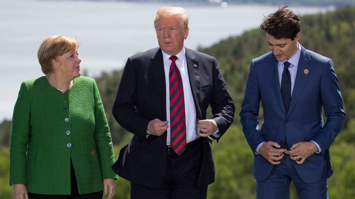 German Chancellor Angela Merkel, President Trump and Canadian Prime Minister Justin Trudeau at the G7 Summit in La Malbraie, Canada, on June 8.