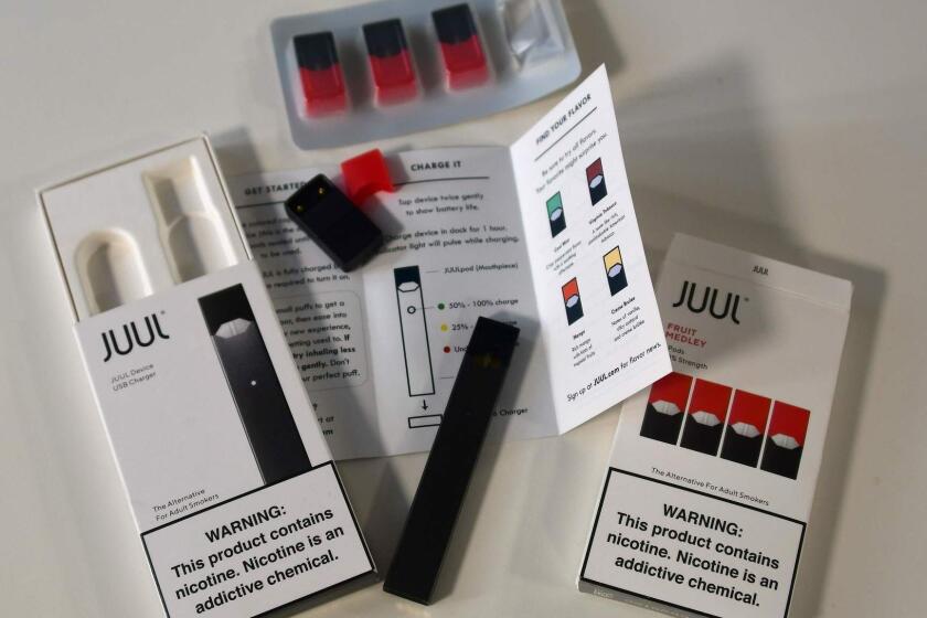 (FILES) In this file photo taken on October 2, 2018 An illustration shows the contents of an electronic Juul cigarette box in Washington. - The US Surgeon General on December 18, 2018, called for "aggressive" action against e-cigarette use, which he said has exploded to epidemic proportions among youth and puts their health and brain development at risk. (Photo by EVA HAMBACH / AFP)EVA HAMBACH/AFP/Getty Images ** OUTS - ELSENT, FPG, CM - OUTS * NM, PH, VA if sourced by CT, LA or MoD **