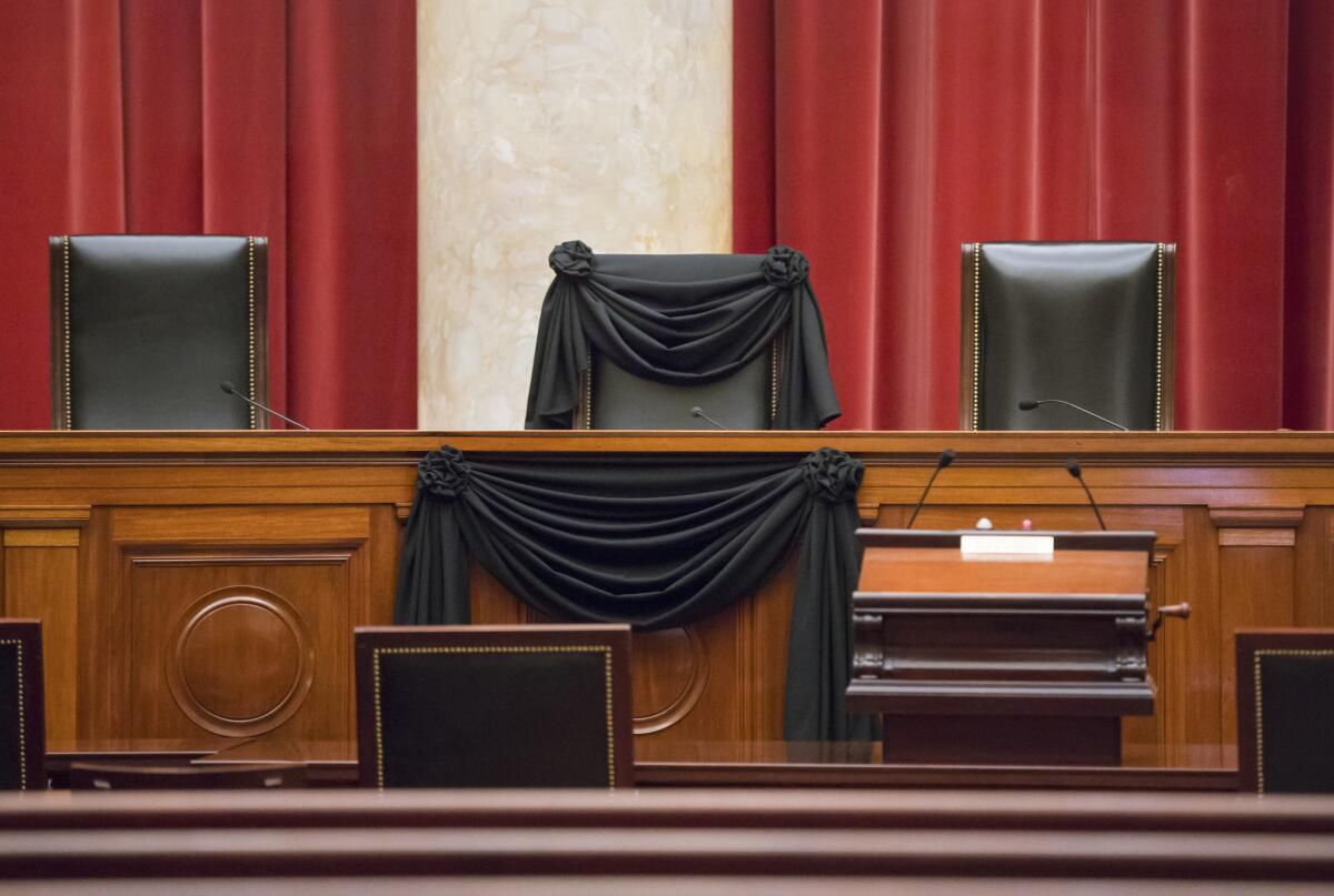 Supreme Court Justice Antonin Scalia’s courtroom chair is draped in black Tuesday to mark his death, as part of a tradition that dates to the 19th century. Scalia died Saturday at age 79. He joined the court in 1986 and was its longest-serving justice.
