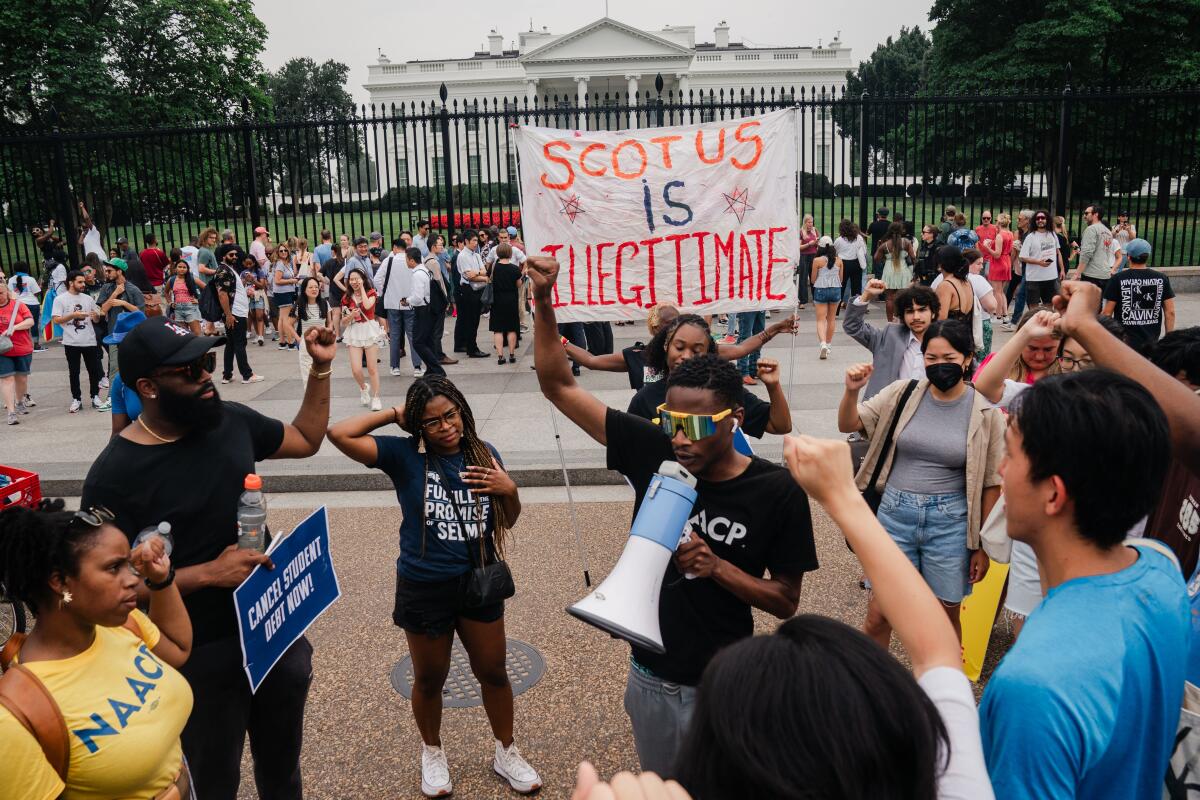 Advocates of canceling student debt demonstrate at the White House on June 30