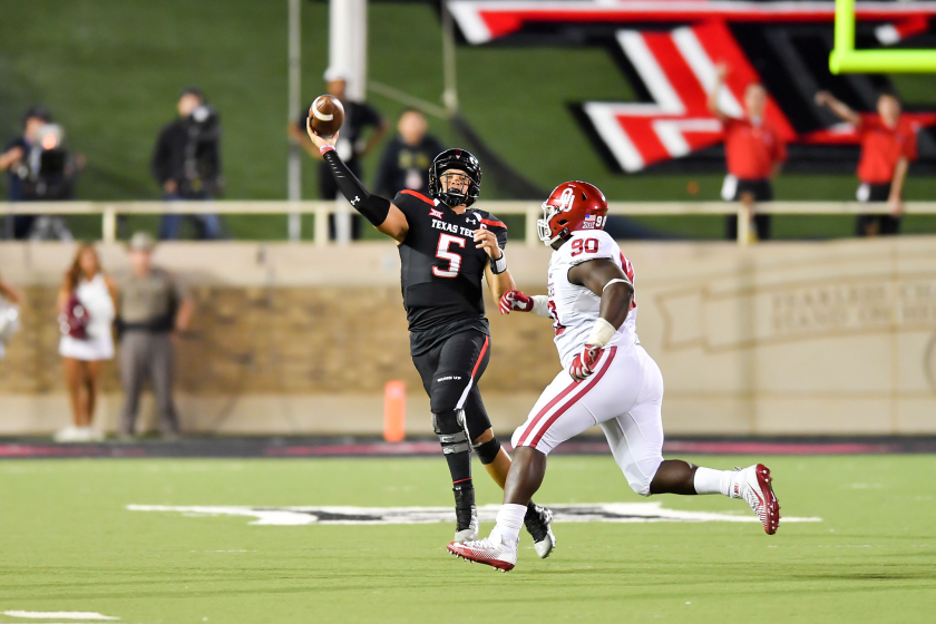 Texas Tech quarterback Patrick Mahomes passes under pressure from Oklahoma's Neville Gallimore.