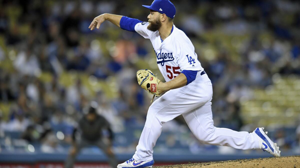 Russell Martin pitches against the Arizona Diamondbacks in an 18-5 Dodgers victory at Dodger Stadium.
