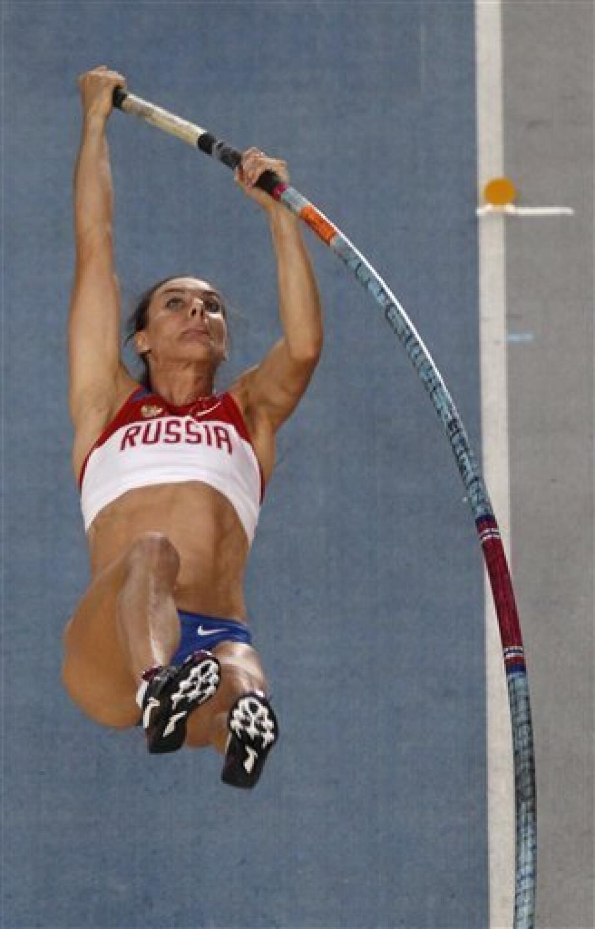 Russia's Yelena Isinbayeva makes an attempt in the Women's Pole Vault final .at the World Athletics Championships in Daegu, South Korea, Tuesday, Aug. 30, 2011. (AP Photo/Kevin Frayer)