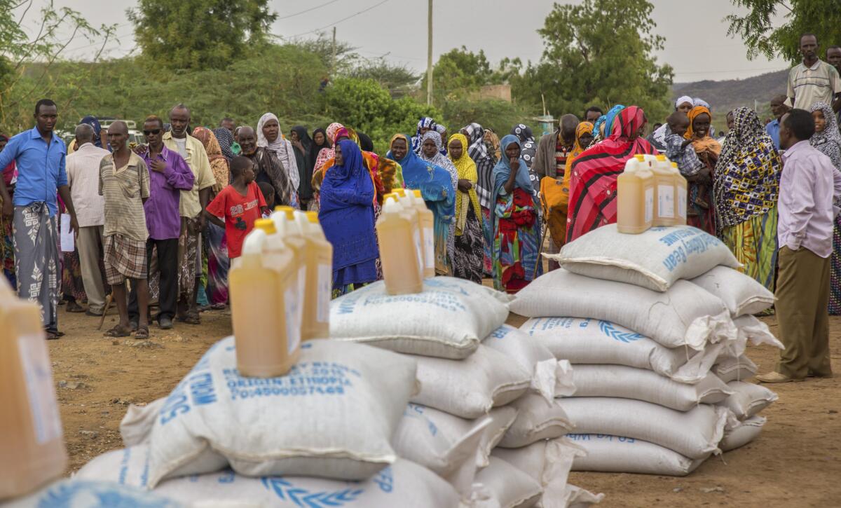 Ethiopians line up to receive aid distributed under a European Union-funded project, in the Shinile Zone of Ethiopia near the border with Somalia.