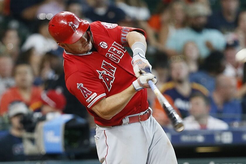 HOUSTON, TEXAS - JULY 07: Mike Trout #27 of the Los Angeles Angels of Anaheim hits a two-run home run in the eighth inning Houston Astros at Minute Maid Park on July 07, 2019 in Houston, Texas. (Photo by Bob Levey/Getty Images) ** OUTS - ELSENT, FPG, CM - OUTS * NM, PH, VA if sourced by CT, LA or MoD **