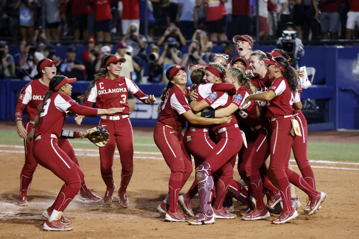 Oklahoma players celebrate after winning the NCAA Women's College World Series championship series over Florida State.