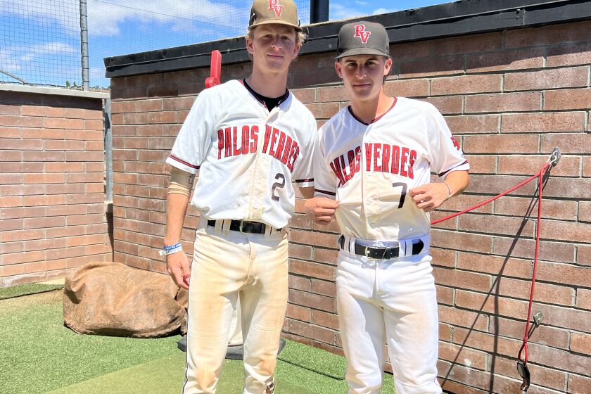 Palos Verdes players Owen Griffiths (left) and Alex Forman show up with dirty uniforms for day 2 of a suspended game. 