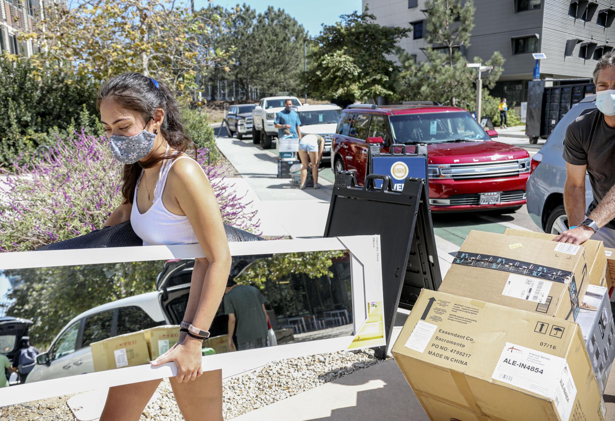 Holly Fleurbaaig moves her belongings into the dormitories with her dad Graham in 2020