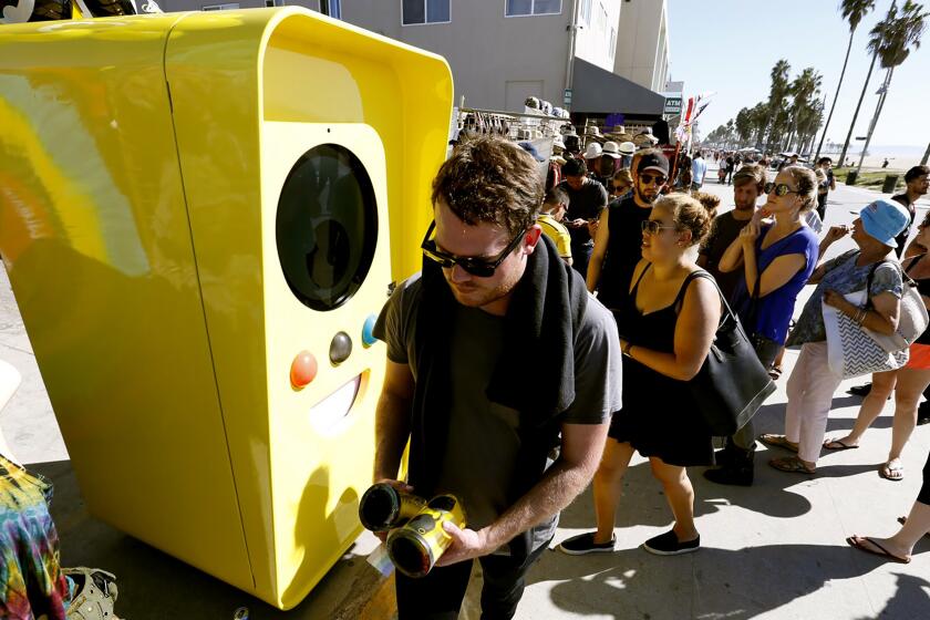 Snapchat Spectacles are dispensed from a bright yellow vending machine on the Venice Beach boardwalk Thursday.