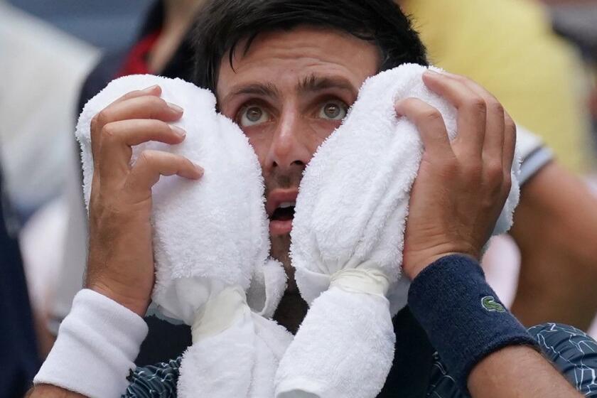 Novak Djokovic of Serbia towels off in the heat against Marton Fucsovics of Hungary during their Day 2 2018 US Open Men's Singles match at the USTA Billie Jean King National Tennis Center in New York on August 28, 2018. (Photo by TIMOTHY A. CLARY / AFP)TIMOTHY A. CLARY/AFP/Getty Images ** OUTS - ELSENT, FPG, CM - OUTS * NM, PH, VA if sourced by CT, LA or MoD **