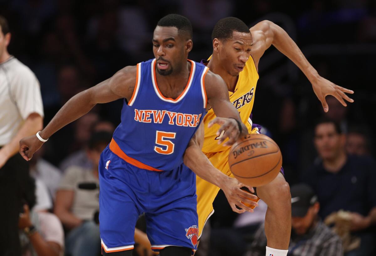 Lakers forward Wesley Johnson goes for the steal against Knicks guard Tim Hardaway Jr. in the first half.