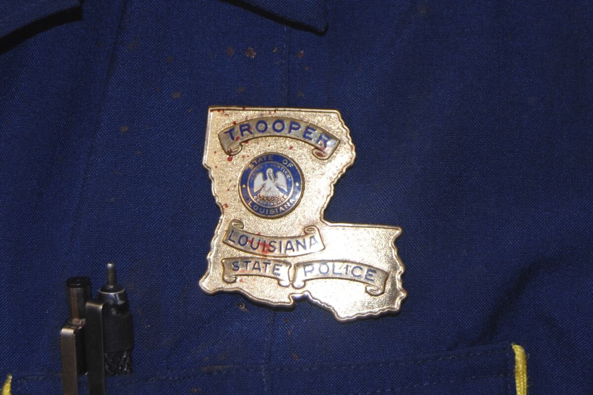 This May 10, 2019 photo provided by the Louisiana State Police shows blood stains on the shield and uniform of Master Trooper Chris Hollingsworth, in West Monroe, La., after troopers punched, dragged and stunned Black motorist Ronald Greene during his fatal 2019 arrest. (Louisiana State Police via AP)