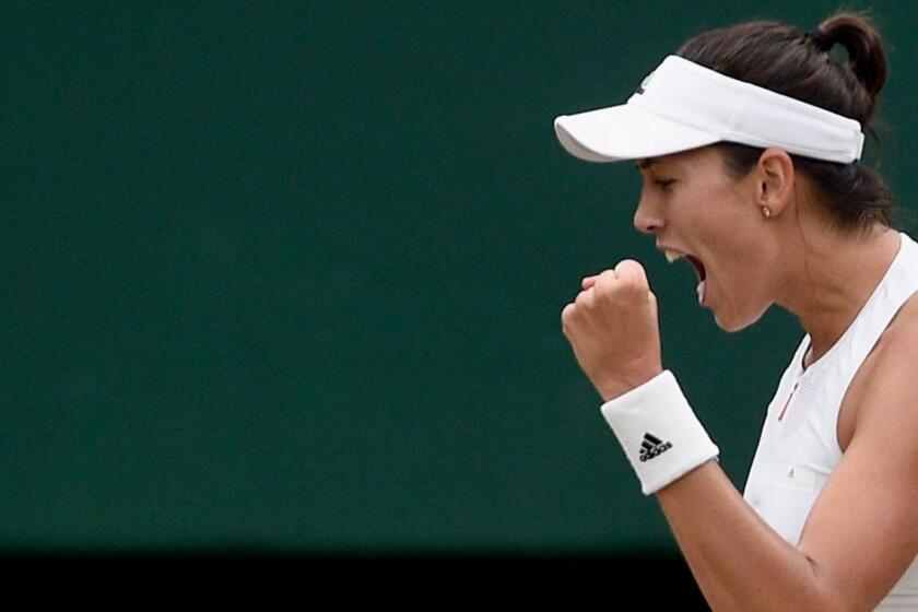 epa06089317 Garbine Muguruza of Spain in action against Venus Williams of the USA during their final match for the Wimbledon Championships at the All England Lawn Tennis Club, in London, Britain, 15 July 2017. EPA/GERRY PENNY EDITORIAL USE ONLY/NO COMMERCIAL SALES ** Usable by LA, CT and MoD ONLY **