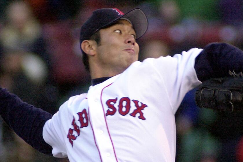 BOSTON, : Boston Red Sox pitcher Hideo Nomo delivers in the first inning against the Baltimore Orioles 10 April 2001 at Fenway Park in Boston. The Japanese righthand pitcher Nomo was named a co-winner of the American League Player of the Week award 09 April 2001 after pitching his second career no-hitter last week in the game against the Baltimore Orioles. AFP PHOTO/JOHN MOTTERN (Photo credit should read JOHN MOTTERN/AFP via Getty Images)