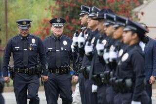 LAPD Chief Jim McDonnell performs the uniform inspection during graduation at the Los Angeles Police Academy.
