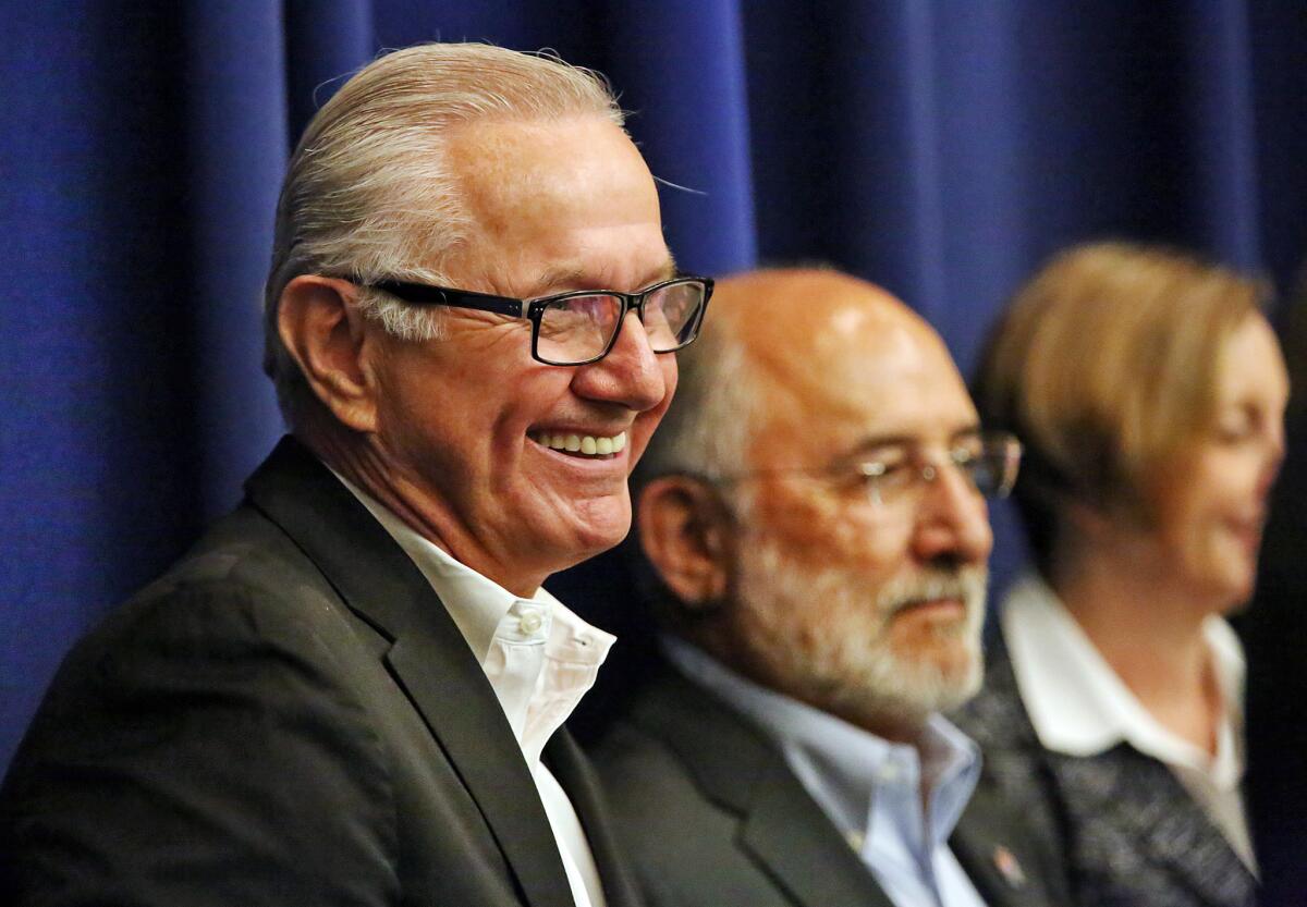 James Henwood Jr., left, chief executive of the Los Angeles County Fair Assn., and J. Michael Ortiz, president of the fair association's board of directors, at a Board of Supervisors meeting Sept. 1.