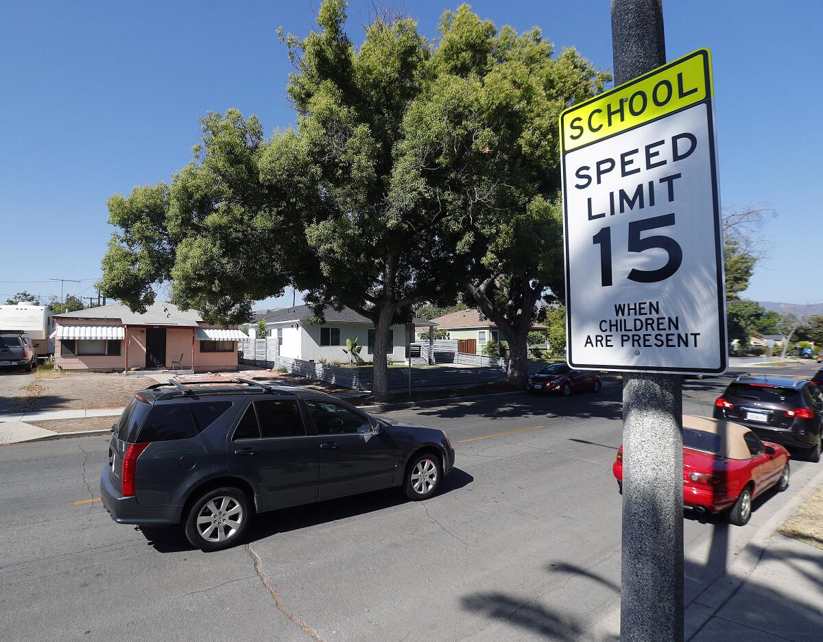 A driver moves through a newly installed 15-mph speed limit school zone in Burbank in 2019. 