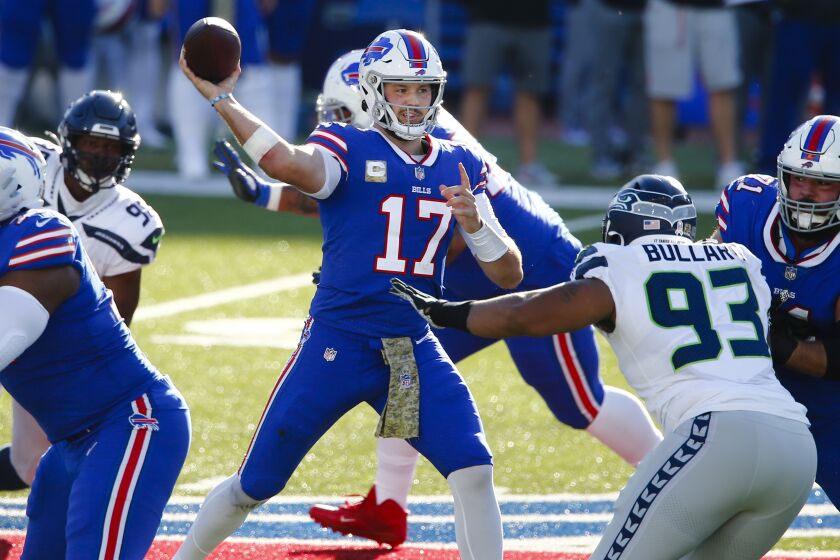 Buffalo Bills quarterback Josh Allen (17) looks to throw a pass during the first half of an NFL football game.