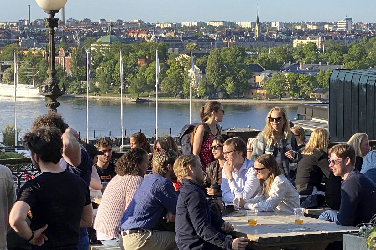 People having drinks and food on an outdoor terrace in Stockholm