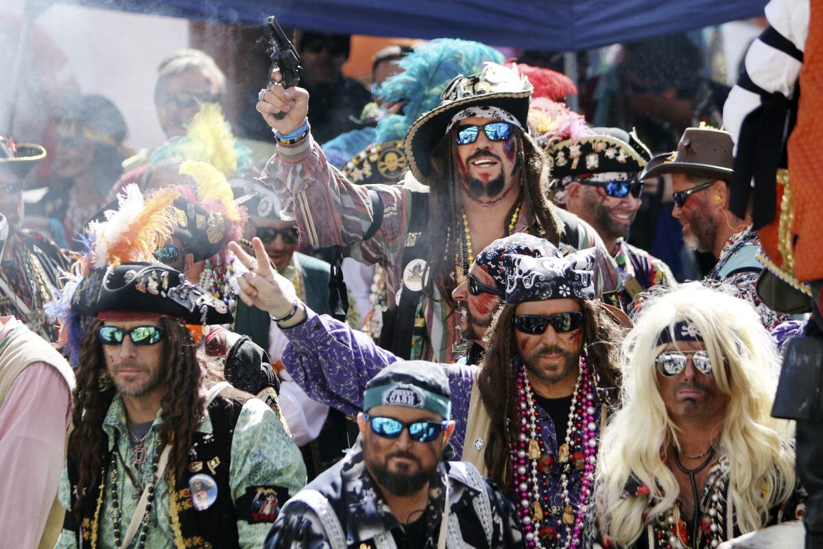 FILE - The Jose Gasparilla pirate ship, carrying members of Ye Mystic Krewe of Gasparilla, arrives at the Tampa Convention Center during the 103nd Gasparilla Invasion and Parade of the Pirates on Saturday, Jan. 25, 2020, in Tampa, Fla. (Douglas R. Clifford/Tampa Bay Times via AP, File)