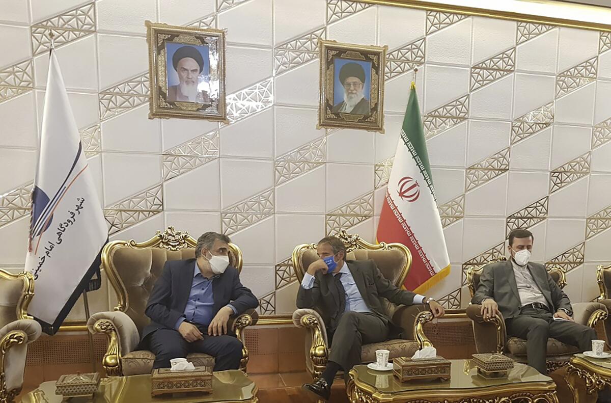 Rafael Grossi, center, and Behrouz Kamalvandi speak in Tehran on Saturday.