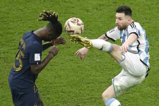 Argentina's Lionel Messi, right, and France's Eduardo Camavinga, left, fight for the ball during the World Cup final soccer match between Argentina and France at the Lusail Stadium in Lusail, Qatar, Sunday, Dec. 18, 2022. (AP Photo/Christophe Ena)