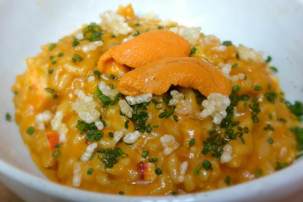 Maine lobster rice with uni, chives, lime and puffed rice.