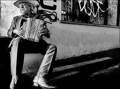 Antonio Hernandez appears to be lost in the moment and the music as he plays an accordion early on a Sunday morning outside Vallarta Tires and Auto Service at 4346 E. Cesar E. Chavez Ave.