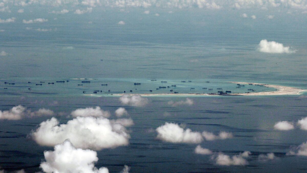 China has expanded small land formations it controls in the South China Sea, piling sand onto outcroppings and building landing strips. The land reclamation of Mischief Reef in the Spratly Islands is seen here in 2015.
