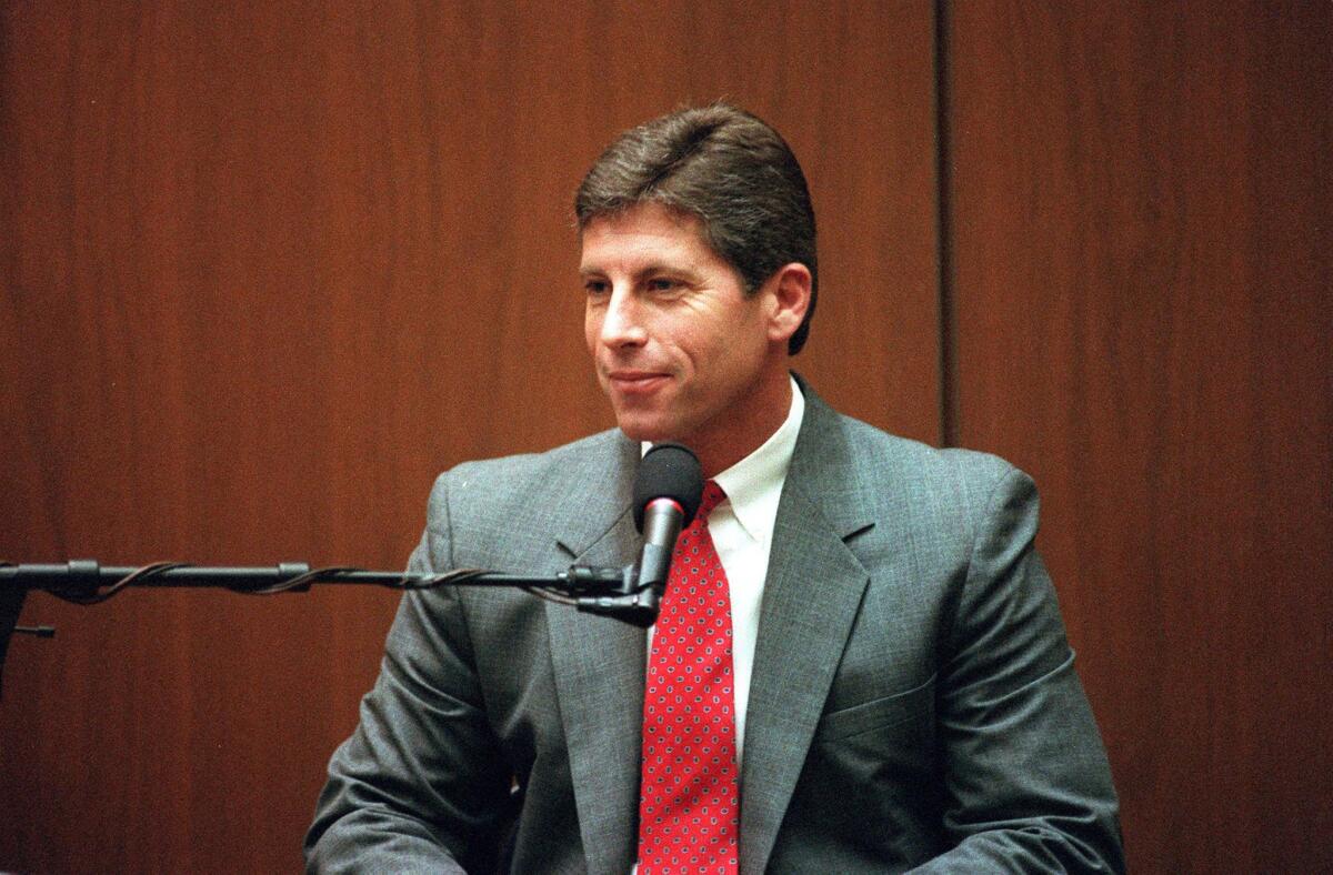 Mark Fuhrman testifies for the prosecution during the O.J. Simpson trial. Fuhrman will later be convicted of perjury for his testimony.