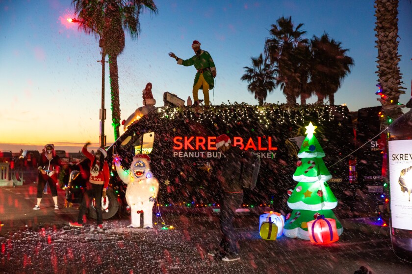 A crew from Skrewball whiskey gets in the holiday spirit during last year's Ocean Beach Holiday Parade.