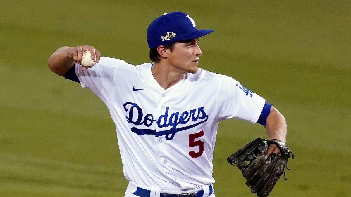Dodgers shortstop Corey Seager throws against the Milwaukee Brewers.