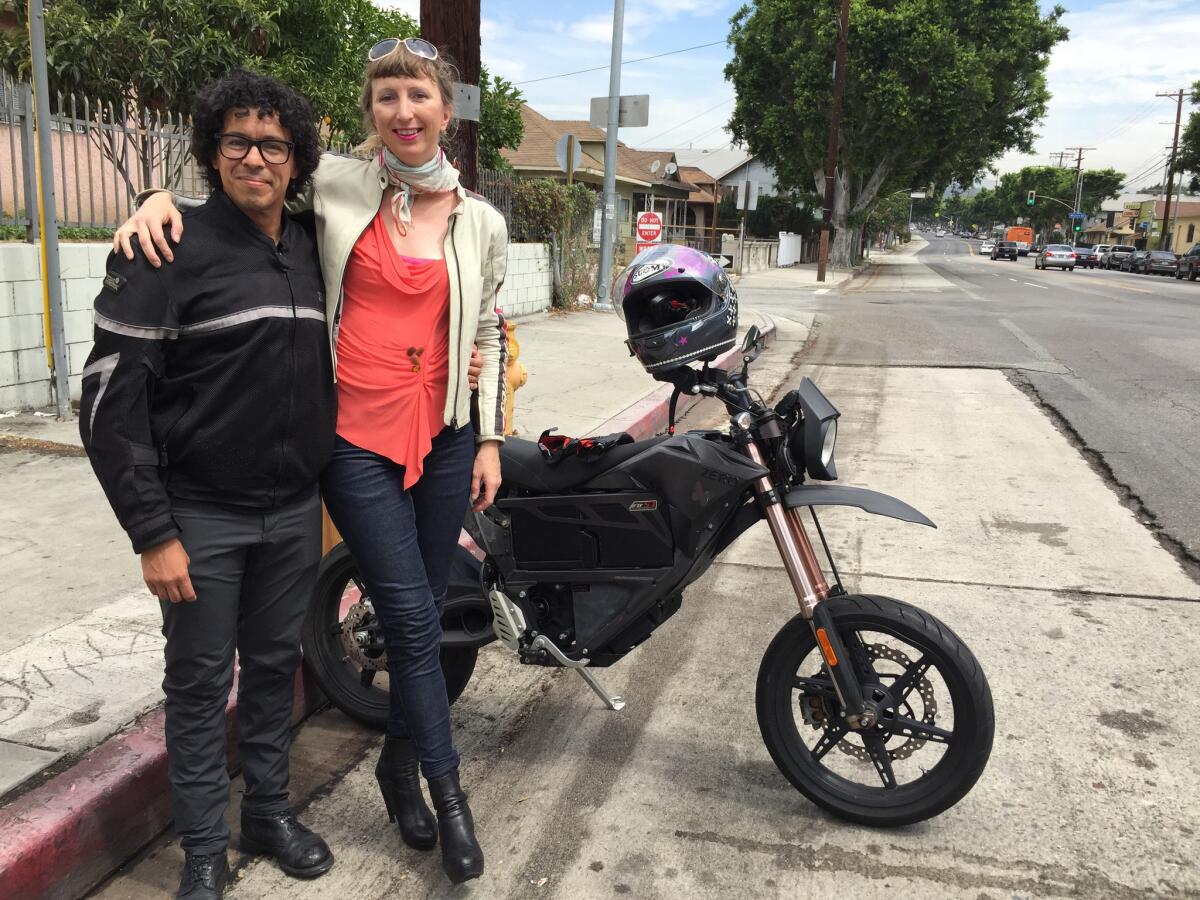 Susanna Schick, 45, with her boyfriend, Robert Verez, 44, and the bike she normally rides, an electric Zero FX.