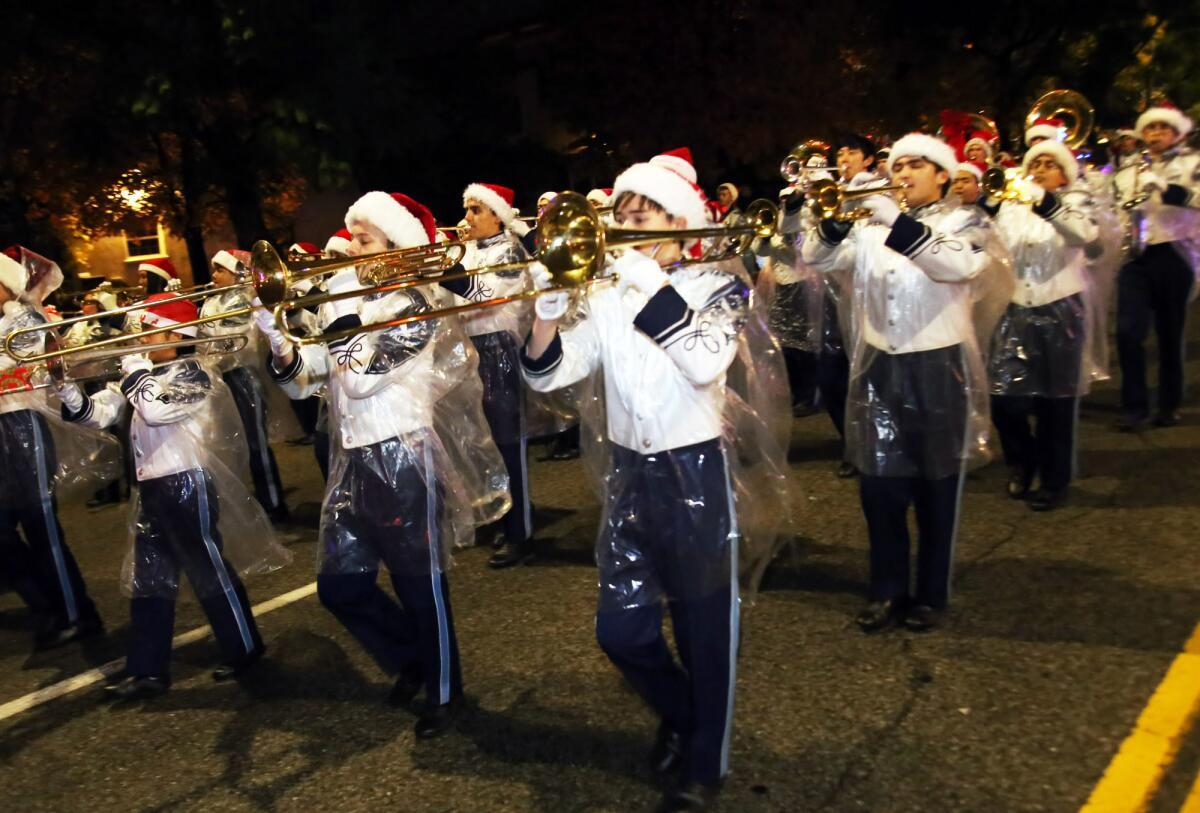 The marching band from Crescenta Valley High School performs during the Montrose Christmas Parade this past Saturday.