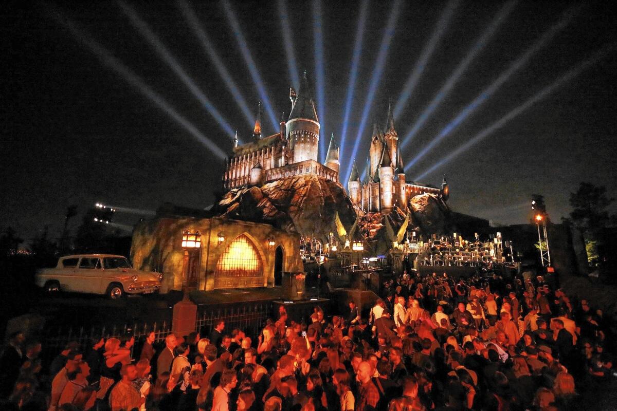 Lights shine behind Hogwarts Castle at Universal Studios Hollywood's new Wizarding World of Harry Potter attraction.