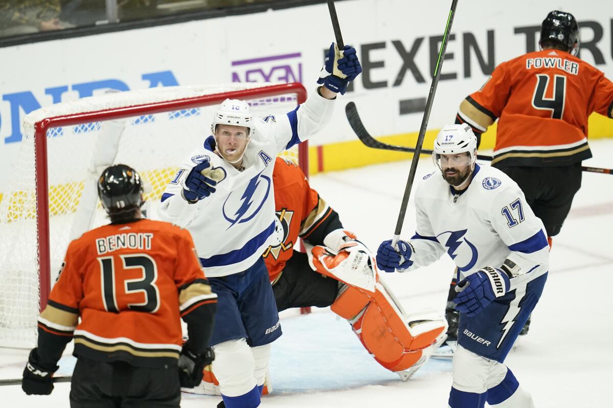 Tampa Bay Lightning's Corey Perry and Alex Killorn celebrate after left wing Brandon Hagel scored against the Ducks.