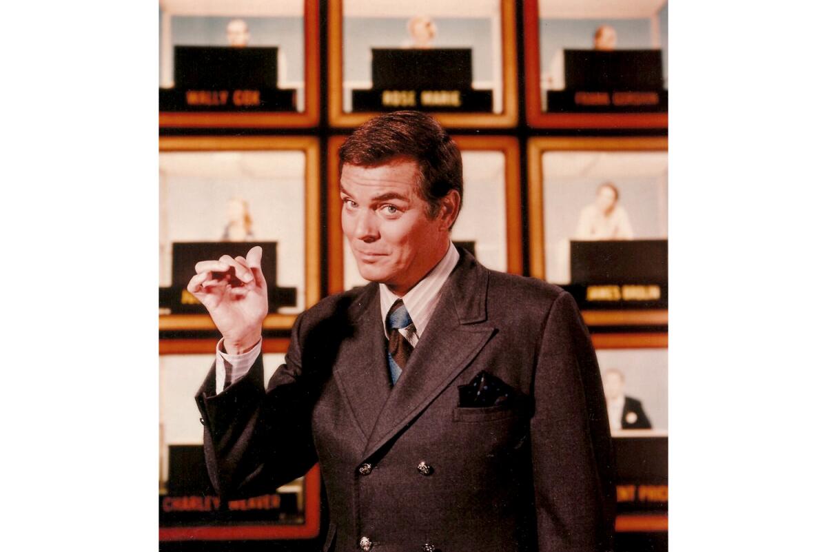 Peter Marshall, host of the original "Hollywood Squares," in front of the show's set