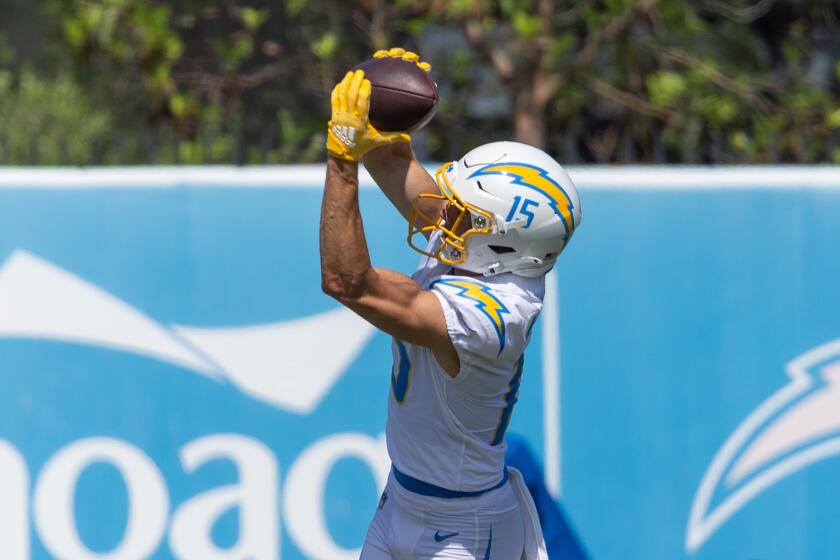 Chargers rookie wide receiver Ladd McConkey catches a pass during practice.