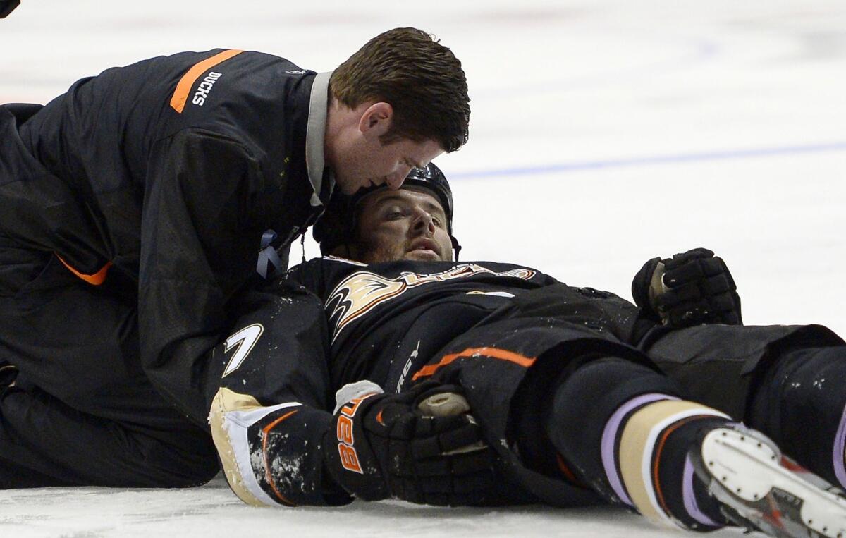 Dustin Penner is attended to by a trainer after being knocked briefly unconscious on a hit by Dallas Star forward Ryan Garbutt last month. Garbutt was suspended five games by the NHL for the hit.
