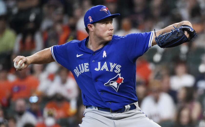 Toronto Blue Jays starting pitcher Nate Pearson delivers during the first inning of a baseball game against the Houston Astros, Sunday, May 9, 2021, in Houston. (AP Photo/Eric Christian Smith)
