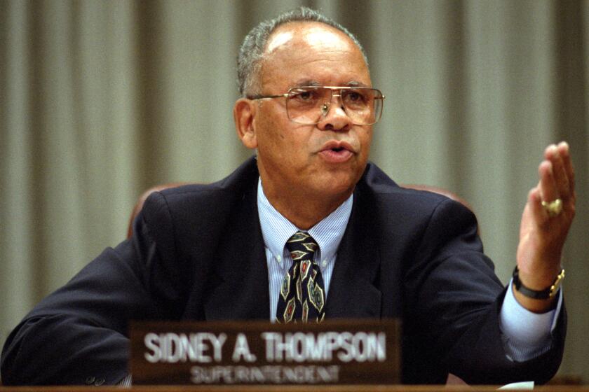 ME.THOMPSON.#2.0725.FG STY BY S. CHAVEZ LA School Board Superintendent Sidney Thompson, who Monday received a two-year extension on his contract, gestures while reading a statement following the announcement. Mandatory Credit: Francis Gardler/THE LOS ANGELES TIMES