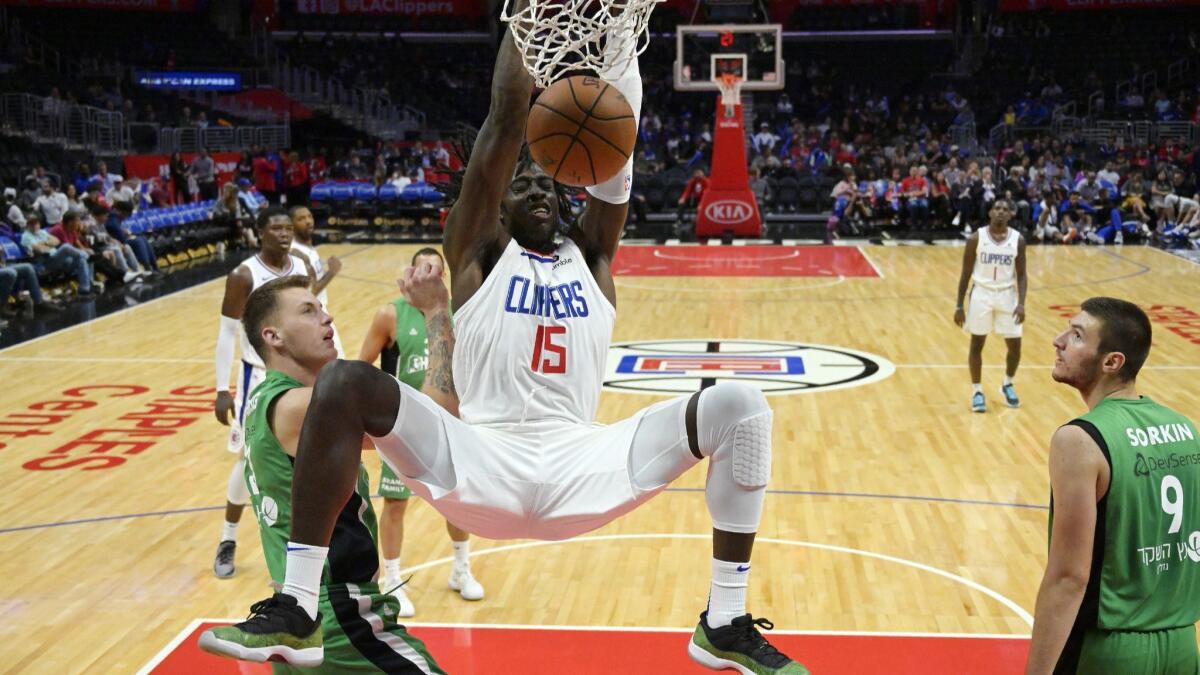Clippers center Johnathan Motley dunks during an exhibition game against Maccabi Haifa on Oct. 11, 2018.