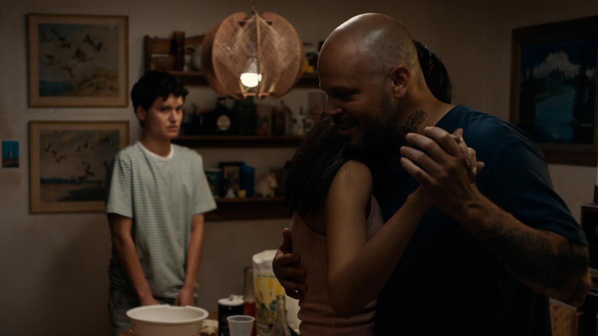 A father dances in his kitchen.