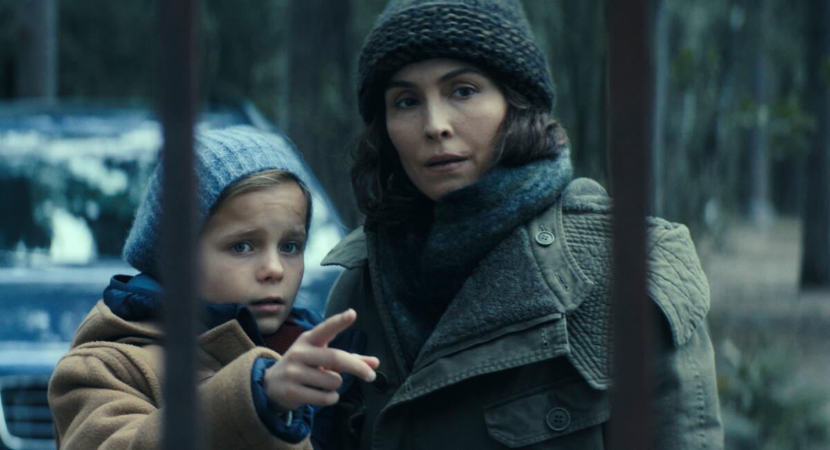 Noomi Rapace, right, stars as Jo Ericsson, an astronaut who returns to Earth after a disastrous event in space.