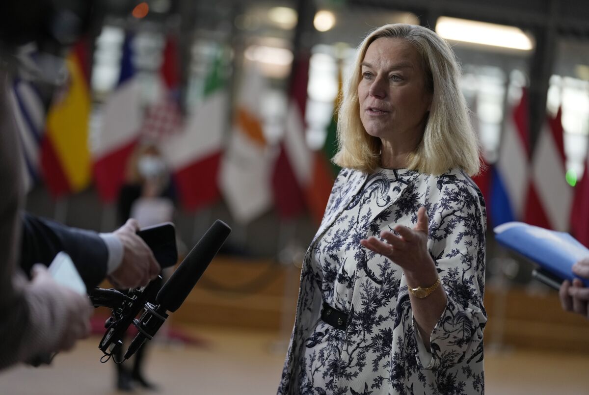 FILE - Dutch Finance Minister Sigrid Kaag speaks with the media as she arrives for a meeting of eurogroup finance ministers at the European Council building in Brussels, Jan. 17, 2022. A man who stood outside the home of former Dutch foreign minister Kaag waving a burning torch and shouting threats was sent to prison Wednesday, Jan. 19 for six months, Dutch media reported.(AP Photo/Virginia Mayo, file)