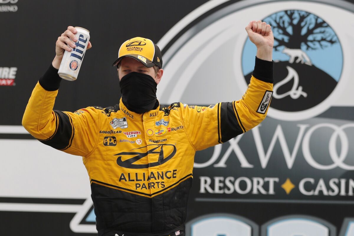 Driver Brad Keselowski celebrates after winning a NASCAR Cup Series auto race, Sunday, Aug. 2, 2020, at the New Hampshire Motor Speedway in Loudon, N.H. (AP Photo/Charles Krupa)