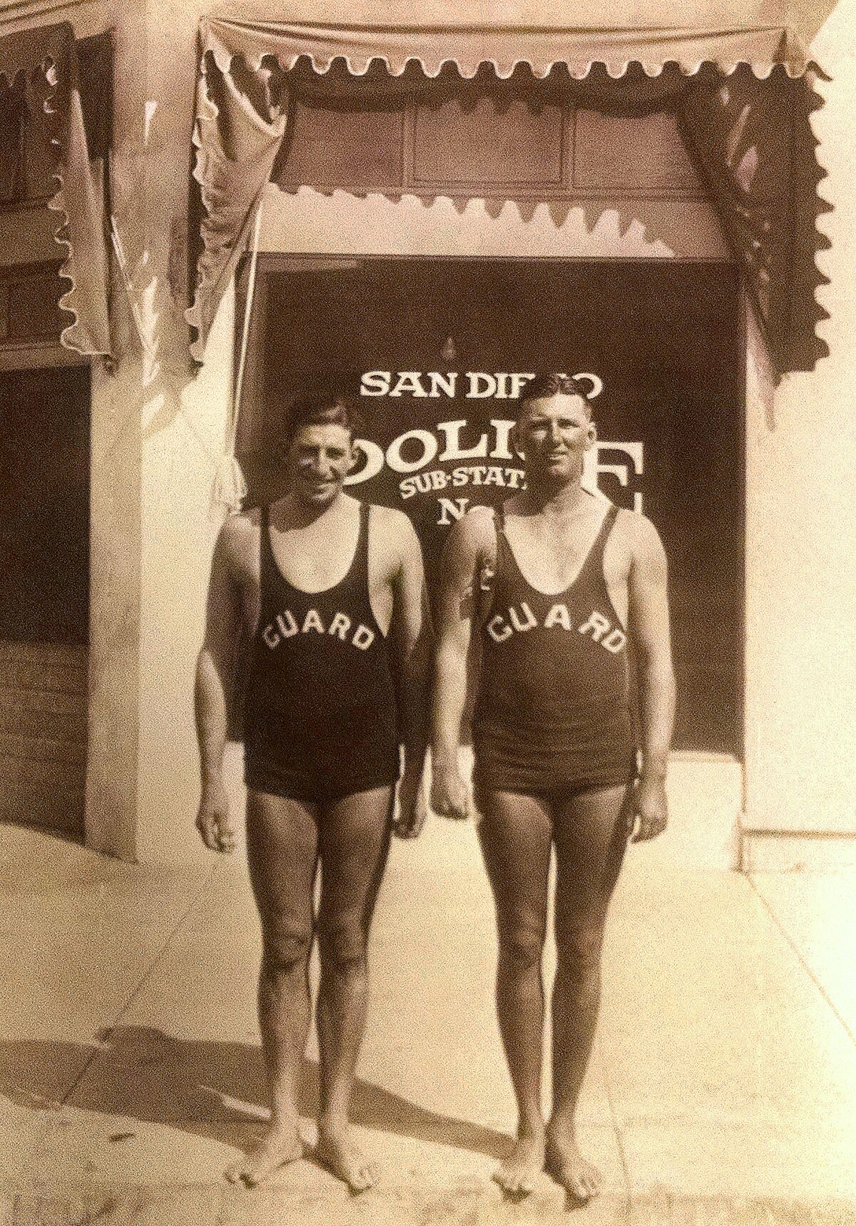 Ocean Beach lifeguards Calvin “Spade” Burns and Art Krause stand at Santa Monica Avenue and Abbott Street in 1927.